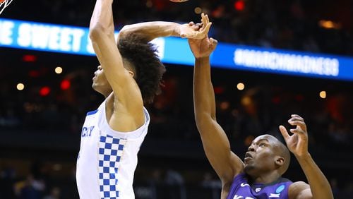 March 22, 2018 Atlanta: Kansas State forward Makol Mawien blocks a shot by Kentucky forward Nick Richards during the first half in a regional semifinal NCAA college basketball game on Thursday, March 22, 2018, in Atlanta.  Curtis Compton/ccompton@ajc.com