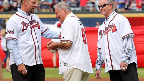 October 02, 2016 Atlanta: John Smoltz (from left) gives Bobby Cox a hug with Tom Glavine looking on during the pregame ceremony for the Braves final game at Turner Field on Sunday, Oct. 2, 2016, in Atlanta.   Curtis Compton /ccompton@ajc.com