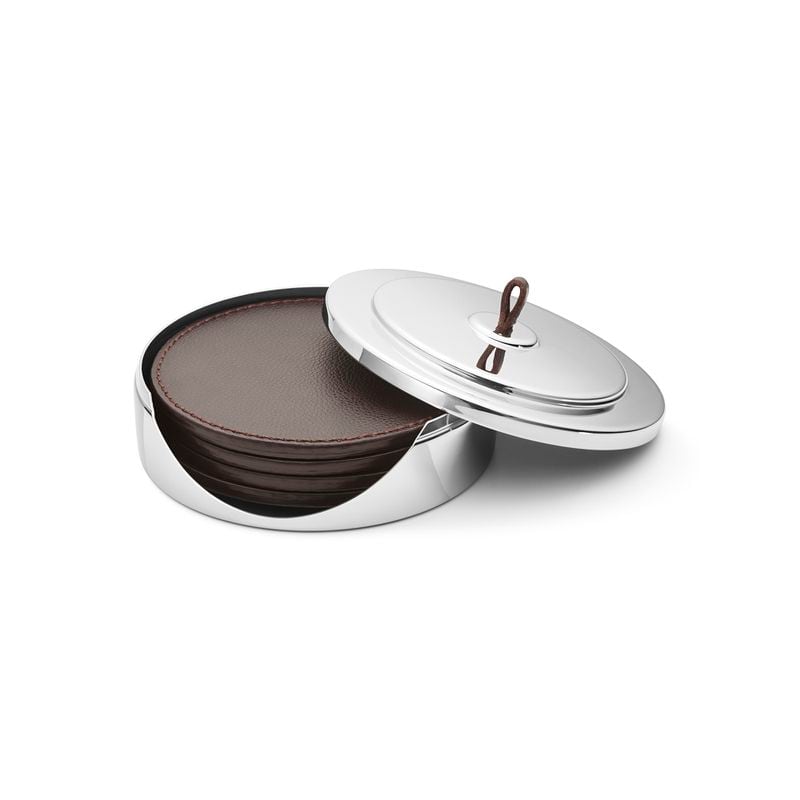 A set of leather coasters in a stainless-steel case from Georg Jensen brings glamour and sophistication to tabletops.
(Courtesy of Georg Jensen)