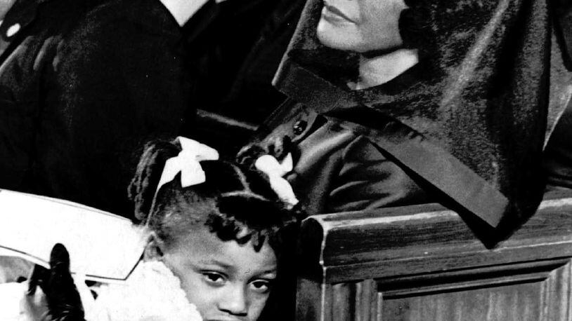 Coretta Scott King and her daughter Bernice, 5, are shown April 9, 1968, attending the funeral of her husband, Dr. Martin Luther King, Jr., in Atlanta, in this Pulitzer-prize winning file photograph taken by Moneta J. Sleet, Jr., the first African-American to win a Pulitzer Prize for photography. (AP Photo/Moneta J. Sleet, Jr.)