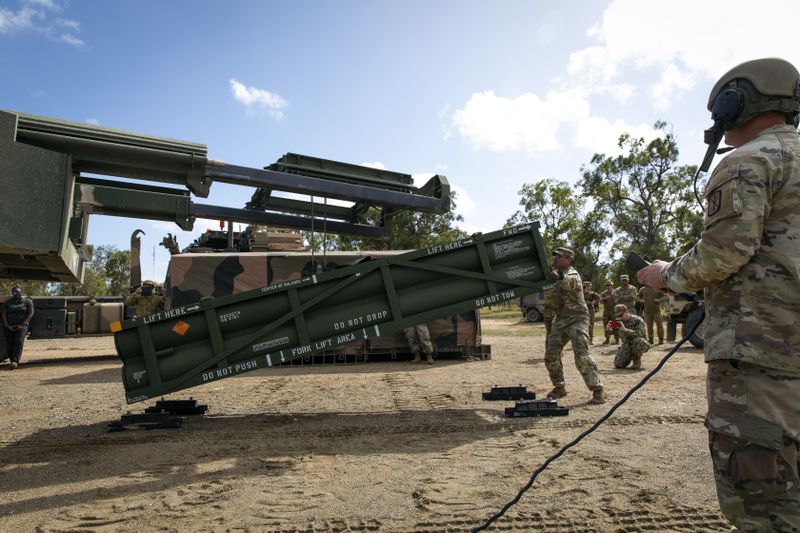 In this image provided by the U.S. Army U.S. Army Staff Sgt. Jimmy Lerma, crew chief for Alpha Battery, 1st Battalion, 3rd Field Artillery Regiment, 17th Field Artillery Brigade, adjusts the Army Tactical Missile System (ATACMS) for loading on to the High Mobility Artillery Rocket System (HIMARS) at Williamson Airfield in Queensland, Australia, on July 26, 2023. U.S. officials say Ukraine for the first time has begun using long-range ballistic missiles, called ATACMS, striking a Russian military airfield in Crimea and Russian troops in another occupied area overnight. (Sgt. 1st Class Andrew Dickson/U.S. Army via AP)