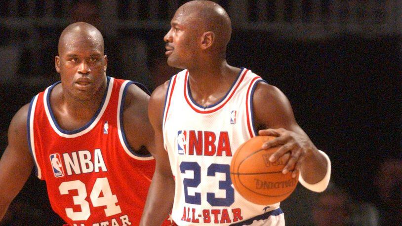 Michael Jordan against Shaquille O'Neal during the 2003 NBA All-Star Game at Philips Arena. (RICH ADDICKS/AJC staff)