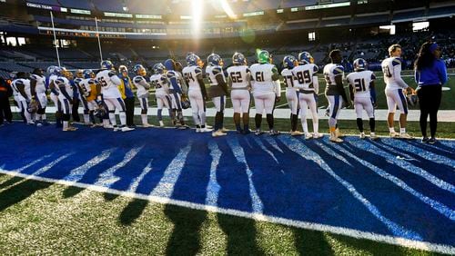 The sun sets on the Crisp County sideline casting long shadows on their hopes of winning the AAA state title football game after they fall behind to Cedar Grove in the fourth quarter, Saturday Dec.14, 2019.Grove won 21-14.