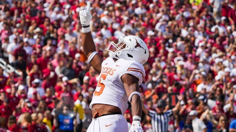 In this photo from Oct. 8, 2022, Texas running back Bijan Robinson (5) celebrates after scoring on a touchdown run during the first half of the annual Red River Showdown football game against Oklahoma at the Cotton Bowl in Dallas. (Smiley N. Pool/The Dallas Morning News/TNS)