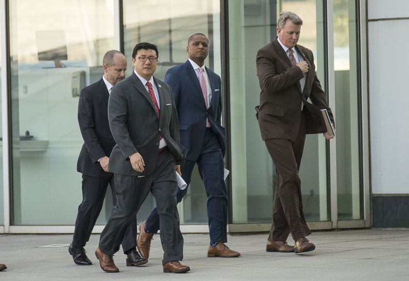United States Attorney BJay Pak (second from left) and FBI Supervisory Special Agent Oliver Rich (second from right) prepare to make remarks during a press conference outside the Richard B. Russell Federal Courthouse in Atlanta on Wednesday, September 4, 2019. (Alyssa Pointer/alyssa.pointer@ajc.com)