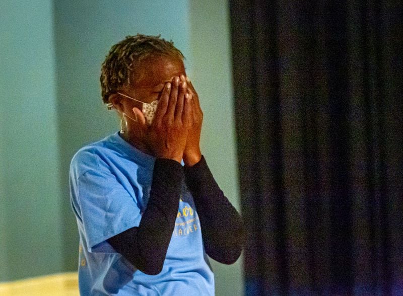 Mays High School teacher Sonja Lewis reacts after learning she won a free trip including airfare and hotel accommodations to any Delta Vacations destination within the U.S., Mexico, or the Caribbean Friday, May 7 2021.  STEVE SCHAEFER FOR THE ATLANTA JOURNAL-CONSTITUTION