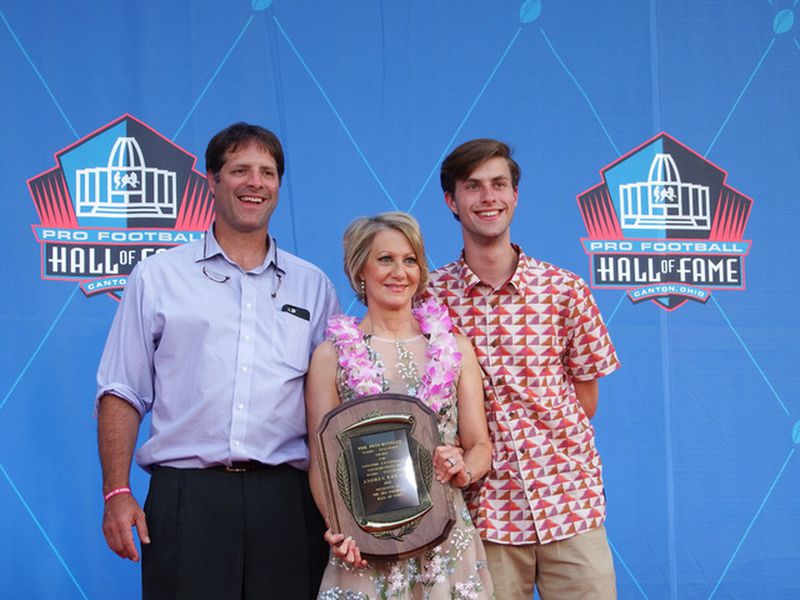 Andrea Kremer poses with her husband, John Steinberg (left), and their son, Will, after receiving the Pro Football Hall of Fame’s Pete Rozelle Radio-Television Award last year. Kremer told Will in her acceptance speech that she hoped all the time she spent away from him had been “somewhat validated” by the award. CONTRIBUTED