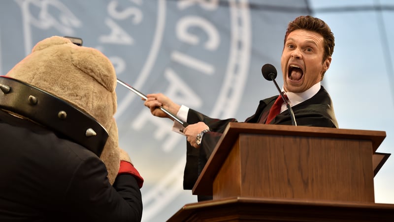"American Idol" host Ryan Seacrest takes a selfie with UGA mascot Hairy Dawg during his Commencement address. Seacrest, who grew up in Dunwoody, attended UGA briefly before pursuing a broadcasting career. More than 5,500 graduates were eligible to participate in the ceremony. BRANT SANDERLIN/BSANDERLIN@AJC.COM