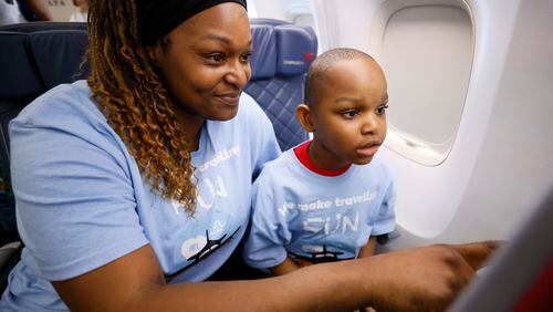Quichecia Johnson works with her son Ayden Johnson (6) as they sit on a Delta airplane during the Wings For All event at Hartsfield-Jackson Atlanta International Airport on Thursday, April 18, 2024.
Miguel Martinez /miguel.martinezjimenez@ajc.com