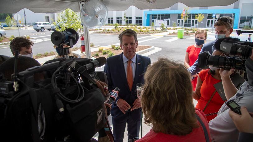 09/01/2020 - Stone Mountain, Georgia - Gov. Brian Kemp answers question from the press before going on a first look of the construction progress at AmazonÕs ATL2 Fulfillment Center in Stone Mountain, Tuesday, September 1, 2020. This center will be AmazonÕs first robotics fulfillment center in Georgia. (Alyssa Pointer / Alyssa.Pointer@ajc.com)