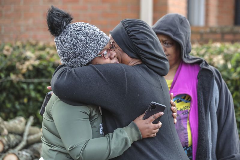November 10, 2021 DeKalb County: Deonna Bray (left) is hugged by Kenyatta Kinnemore (right) while waiting on news on Bray’s missing son, 1-year old  Blaise Barnett who was taken when the car he was in was stolen while his parents were offloading groceries in front of their Clarkston apartments at Parc 1000 on 1000 Montreal Road. on Wednesday Nov. 10, 2021. It took maybe 30 seconds for the family of Blaise Barnett to take their eyes off the 1-year-old boy as they unloaded groceries Wednesday morning, and he was gone. In that time, someone climbed into the driver’s seat of their gray Ford Explorer and took off with the toddler, wearing only a diaper and a black shirt with blue dinosaurs, still strapped in his car seat. An Amber Alert was issued for the child early Wednesday, and neither he nor his family’s vehicle has been located in the nine hours since. “I just kept saying this is a dream. This just can’t be real,” his father, Xavier Barnett, told The Atlanta Journal-Constitution from outside his Clarkston apartment as the search continued. “I just broke down. Please, bring him home. The car don’t even matter, just bring my son home.” Blaise Barnett was reported missing at 1 a.m. from the Parc 1000 apartments at 1000 Montreal Road. According to a police report, Blaise’s parents were running bags of groceries to their apartment and returned to the parking lot to find their vehicle and their son gone. His father told police he carried his 3-year-old nephew inside first and was coming back for the toddler. “He was in there for probably like 30 seconds, maybe, and within those 30 seconds he came back outside and the car was gone with Blaise in it,” Deonna Bray, the child’s mother, told the AJC. The vehicle was not left running, but its keys were in the cupholder, according to the report. Blaise was strapped into a black and tan car seat and had a blanket wrapped around his legs, his parents told police. The GBI issued the alert, known as a Levi’s Call in Georgia, on behalf of the Clarkston Police Department. The Barnett family said the toddler’s name was misspelled in the alert. There have been no sightings as of 10:30 a.m. Wednesday, and police have not located the vehicle on any surveillance cameras in the area. Investigators have not developed any leads, Clarkston police Chief Christine Hudson told reporters as the search entered the 10th hour. The police department has devoted all of its resources, including patrol officers and detectives, to canvassing the area. DeKalb County police, the GBI and the FBI are also out looking for Blaise. “This is now a nationwide search,” the chief said, adding she wished she had more to give the Barnett and Bray families. “Waiting, that is the hardest part,” Deonna Bray said. “Not knowing. The waiting.” Blaise is believed to be traveling in the gray 2002 Ford Explorer, which has a temporary Georgia tag P2722946. According to the police report, there are wooden sticks holding up two back windows. Anyone who spots the child or the vehicle is asked to call Clarkston police at 404-557-8956 or dial 911. (John Spink / John.Spink@ajc.com)


