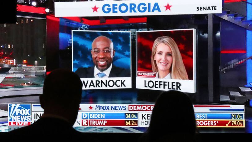 Republican supporters watch returns for Democratic U.S. Senate candidate Raphael Warnock and Republican incumbent Kelly Loeffler come in at the Georgia Republican Party Election Night Celebration Party at the Intercontinental Buckhead Atlanta hotel on Tuesday, Nov. 3, 2020, in Atlanta. (Curtis Compton/Atlanta Journal-Constitution/TNS)