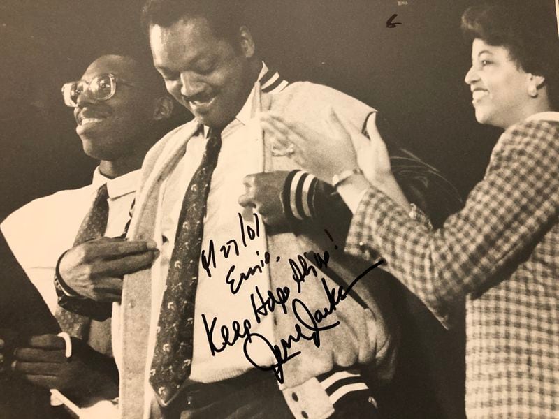 In 1988, Jesse Jackson brought his presidential campaign and his Afro to the campus of North Carolina Central University. Here, he is presented a school jacket by campus newspaper editor Ernie Suggs and Miss NCCU Sonya Laws. (Courtesy of Ernie Suggs)