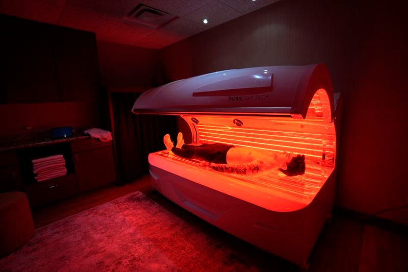 A TheraLight red light therapy bed is pictured at the MIORA clinic at the Life Time at Target Center, Wednesday, April 3, 2024, in Minneapolis. Luxury athletic club operator Life Time launched a program that offers comprehensive medical testing, personalized training and a host of alternative therapies like cryotherapy. The Miora program also offers Ozempic and other weight loss drugs through the clinic that opened in Minneapolis last year. (AP Photo/Abbie Parr)