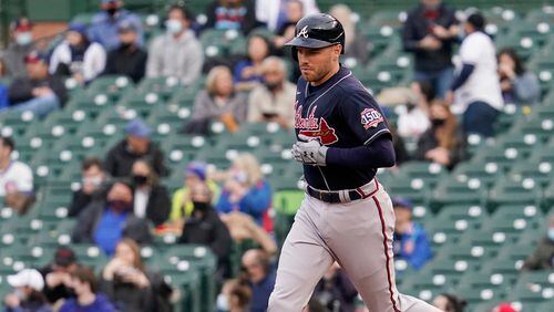 Braves first baseman Freddie Freeman rounds the bases after hitting a solo home run during the first inning Sunday, April 18, 2021,  against the Chicago Cubs at Wrigley Field in Chicago. (Nam Y. Huh/AP)