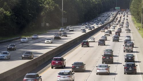 Automobiles travel along Georgia 400, Tuesday, July 23, 2019. Cities along Ga. 400 are talking about petitioning the Georgia Department of Transporation to have a say in how the new highway is being designed as part of the ongoing widening project. (Alyssa Pointer/alyssa.pointer@ajc.com)