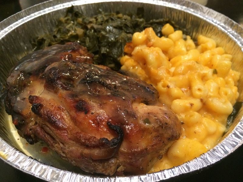 The “Slow Smoked” chicken at Annie Mae’s Pantry rests in a classic broth of thyme, garlic and onions and comes with two sides — such as macaroni and cheese and collards. CONTRIBUTED BY WENDELL BROCK