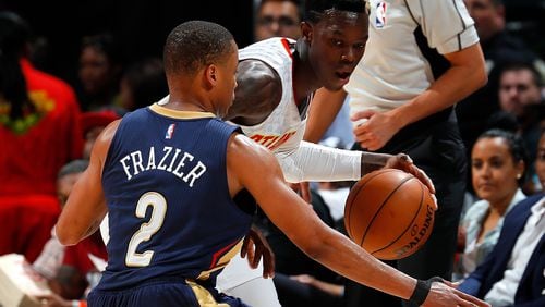 Tim Frazier of the Pelicans defends against Dennis Schroder of the Hawks at Philips Arena on October 18, 2016 in Atlanta, Georgia. (Photo by Kevin C. Cox/Getty Images)