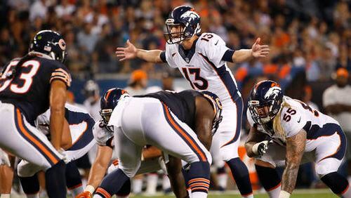 FILE - In this Aug. 11, 2016, file photo, Denver Broncos quarterback Trevor Siemian (13) calls a play at the line of scrimmage during the first half of an NFL preseason football game against the Chicago Bears in Chicago. The Carolina Panthers are out to rattle Siemian Thursday night, Sept. 8, in his first start for the Super Bowl champion Broncos. Thing is, his teammates say they've never seen the strong-armed, mobile QB lose his cool. (AP Photo/Nam Y. Huh, File)