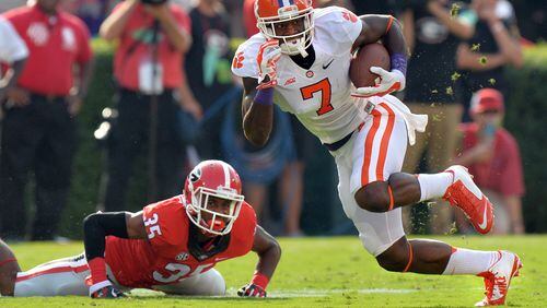 August 30, 2014 Athens, GA: Clemson Tigers wide receiver Mike Williams heads up field after catching a pass in front of Georgia Bulldogs cornerback Aaron Davis during the first half against Saturday August 30, 2014 in Athens. BRANT SANDERLIN / BSANDERLIN@AJC.COM