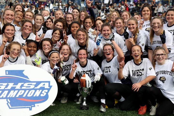 West Forsyth and quarterback Haylee Dornan (center, with ball) pose for a photograph after they won 26-25 against Hillgrove in the Class 6A-7A Flag Football championship at Center Parc Stadium Monday, December 28, 2020 in Atlanta, Ga.. JASON GETZ FOR THE ATLANTA JOURNAL-CONSTITUTION