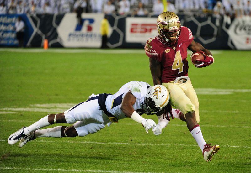 ATLANTA, GA - OCTOBER 24: Dalvin Cook #4 of the Florida State Seminoles evades the tackle attempt by Step Durham #8 of the Georgia Tech Yellow Jackets on October 24, 2015 at Bobby Dodd Stadium in Atlanta, Georgia. Photo by Scott Cunningham/Getty Images)