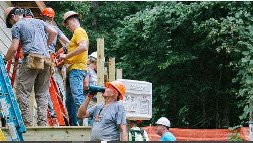 This is the 16th year that North Point Ministries has led the Be Rich campaign to help nonprofits and communities. Here, church volunteers recently gather to help build three Atlanta Habitat for Humanity houses.