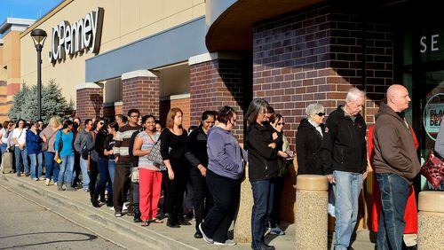 Shoppers wait in line outside the JC Penny store at Bridgewater Falls to take advantage of the pre-Black Friday sales on Thanksgiving Day Thursday, Nov. 26 in Fairfield Township. There were almost 200 people in line when the store opened at 3 p.m. NICK GRAHAM/STAFF
