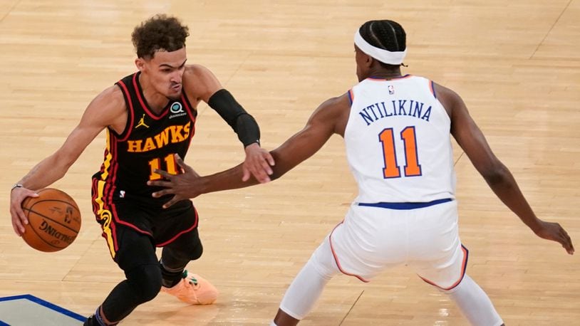 New York Knicks' Frank Ntilikina (right) guards Atlanta Hawks' Trae Young during the second half of Game 1 of first-round playoff series, Sunday, May 23, 2021, in New York. The Hawks won 107-105. (Seth Wenig/AP)