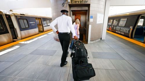 Travelers are seen entering the elevator at the newly renovated MARTA Airport Station, which opened to the public on Monday, May 20, 2024. The renovation, which took about six weeks, included new flooring, replacing ceilings and lighting, and installing infrastructure for a new elevator.
(Miguel Martinez / AJC)