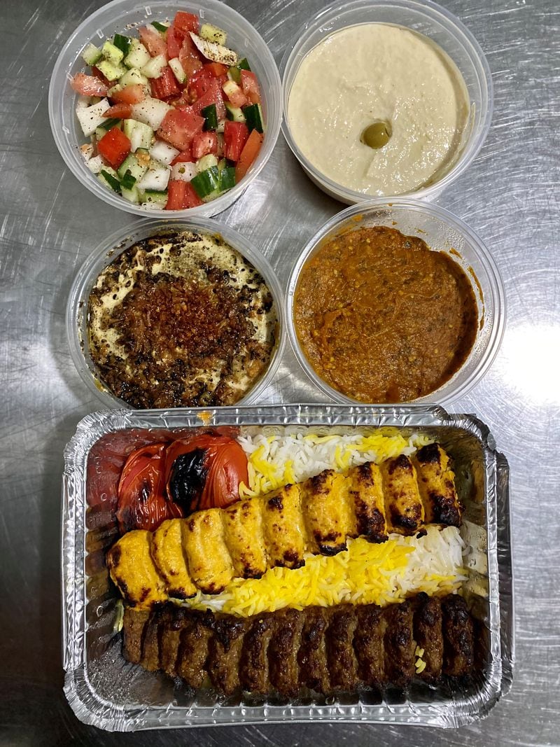 Taaj Kabob & Grill appetizers, salads and kebabs include (from top): Shirazi salad and hummus; dip of fried eggplant with whey and dip of smoked eggplant with tomatoes and garlic; and a combo  of chicken and beef koobideh kebabs. Wendell Brock for The Atlanta Journal-Constitution