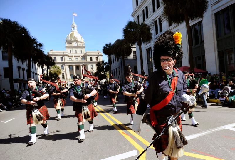 Doc Foley leads the Yonkers, N.Y., Fire Department Pipe and Drum in Savannah's St. Patrick's Day Parade in 2013. The parade, which was started in 1824 by early Irish immigrants to Georgia, is now the second-largest held in the country to celebrate the fifth-century missionary who brought Christianity to Ireland. (AP Photo/Stephen Morton)