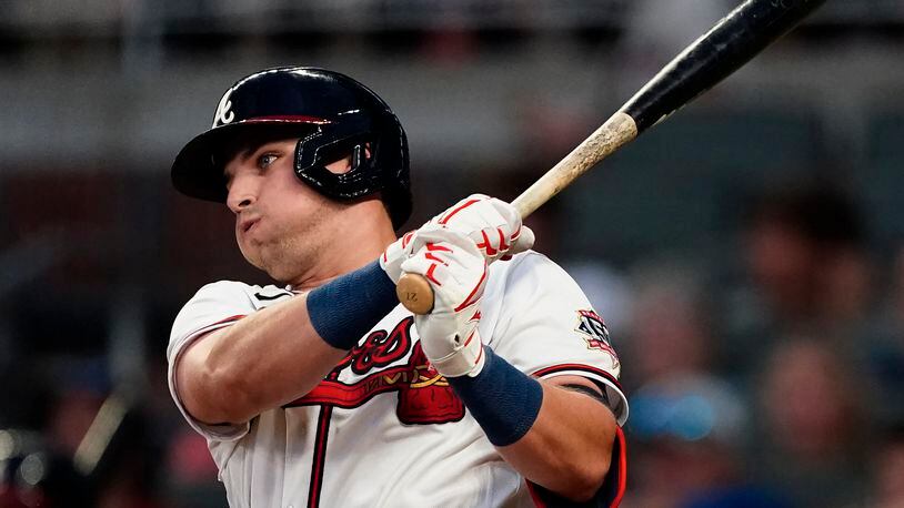 Atlanta Braves' Austin Riley follows though on a two-run single during the third inning of the team's baseball game against the New York Mets on Wednesday, June 30, 2021, in Atlanta. (AP Photo/John Bazemore)