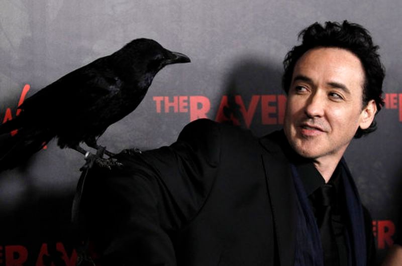 Cast member John Cusack arrives at the premiere of 'The Raven' in Los Angeles, Monday, April 23, 2012. 'The Raven' opens in theaters April 27, 2012.