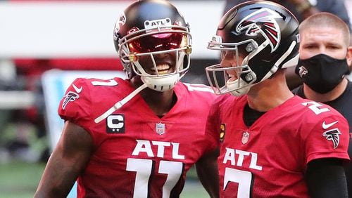 Falcons quarterback Matt Ryan (2) and wide receiver Julio Jones (11) take the field ahead of game against the Detroit Lions Sunday, Oct 25, 2020, at Mercedes-Benz Stadium in Atlanta.  (Curtis Compton / Curtis.Compton@ajc.com)