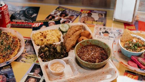This catfish platter at Good Hot Fish includes Sea Island red peas, stewed greens, macaroni and cheese, refrigerator pickles, hush puppies and tartar sauce. Courtesy of Good Hot Fish
