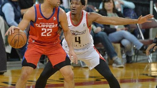 Andrew White defends J.J. O'Brien during a G-League game.