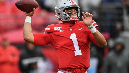Ohio State quarterback Justin Fields fires off a pass against Wisconsin in the first quarter of the Buckeyes big victory Saturday. (Photo by Jamie Sabau/Getty Images)