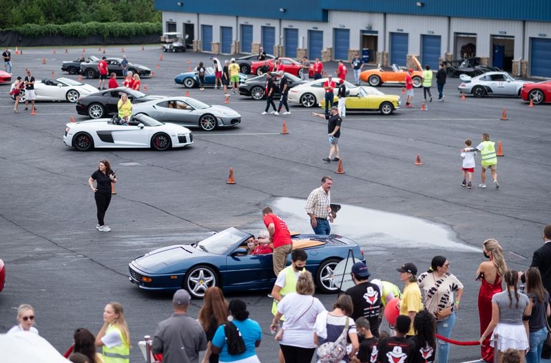 Cars line the paddock during Ferrari of Atlanta’s "Rides to Remember" event Saturday in Dawsonville. (Ben Gray for the Atlanta Journal-Constitution)