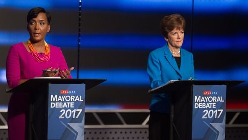 Atlanta mayoral contenders Keisha Lance Bottoms (left) and Mary Norwood speak at the WSB live debate on Sunday in Atlanta. STEVE SCHAEFER / SPECIAL TO THE AJC