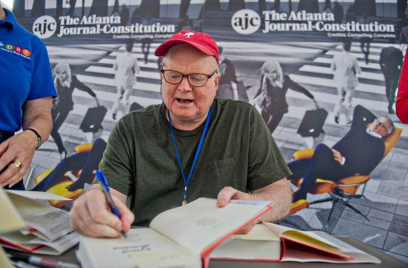 Author Pat Conroy signs books for fans during the AJC Decatur Book Festival on Aug. 30, 2014. AJC file photo: JONATHAN PHILLIPS