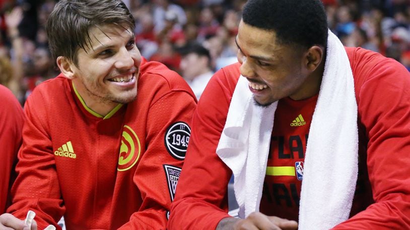 With the game well in hand Hawks Kyle Korver and Kent Bazemore share a laugh on the bench in the final minutes of a victory over the Celtics in Game 5 of an NBA basketball first-round playoff series at Philips Arena on Tuesday, April 26, 2016, in Atlanta. Curtis Compton / ccompton@ajc.com