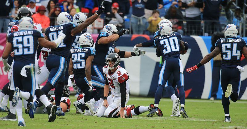 102515 NASHVILLE: -- Falcons quarterback Matt Ryan reacts as the Titans celebrate intercepting him during the second quarter in a football game on Sunday, Oct. 25, 2015, in Nashville. Curtis Compton / ccompton@ajc.com