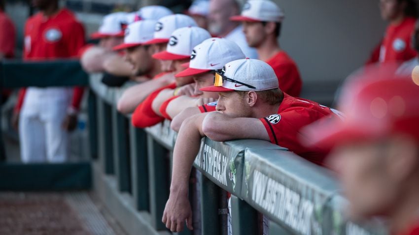 UGA players watch from the dugout during the 20th Spring Classic against Georgia Tech on Sunday at Coolray Field in Lawrenceville. (Jamie Spaar / for The Atlanta Journal-Constitution)
