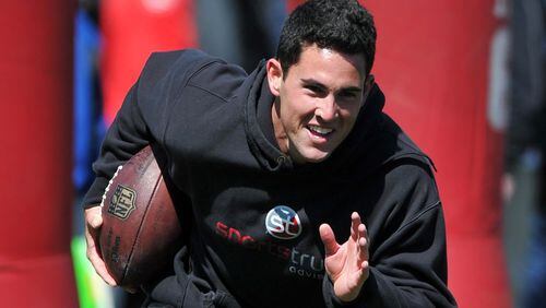 Former Georgia quarterback Aaron Murray warms-up before working out in front of NFL scouts during UGA’s Pro Day Wednesday April 16, 2014, in Athens.