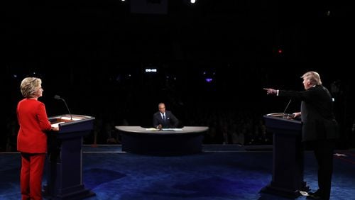 HEMPSTEAD, NY - SEPTEMBER 26: Republican presidential nominee Donald Trump (R) debates Democratic presidential nominee Hillary Clinton as Moderator Lester Holt (C) looks on during the Presidential Debate at Hofstra University on September 26, 2016 in Hempstead, New York. The first of four debates for the 2016 Election, three Presidential and one Vice Presidential, is moderated by NBC's Lester Holt. (Photo by Joe Raedle/Getty Images)