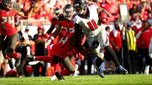 Wide receiver Julio Jones  of the Atlanta Falcons picks up a first down in the fourth quarter of the game at Raymond James Stadium on December 30, 2018 in Tampa, Florida. (Photo by Will Vragovic/Getty Images)