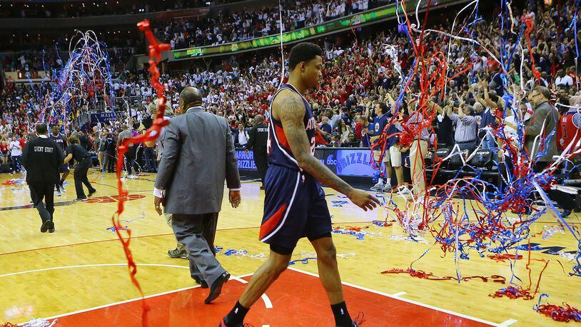 Streamers fall for the Wizards as the Hawks’ Kent Bazemore walks off the court after a 103-101 loss in Game 3 of the Eastern Conference semifinals at the Verizon Center on Saturday. (Curtis Compton/ccompton@ajc.com)