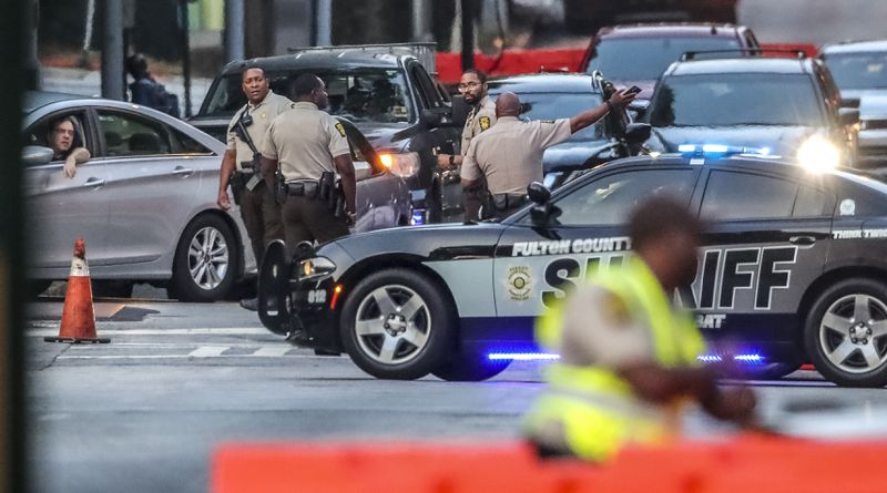 Fulton County Sheriff deputies shut off Central Avenue (shown here) and other surrounding streets at the Fulton County Courthouse on Monday, May 2, 2022 as the selection of a special grand jury began. (John Spink / John.Spink@ajc.com)


