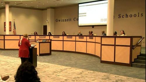 The Gwinnett County School Board presides over a recent meeting. Some board members are pressing staff for more details about proposals to inform their decision-making. AJC FILE PHOTO.